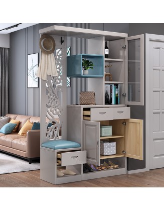 A foyer cabinet with a built-in stool